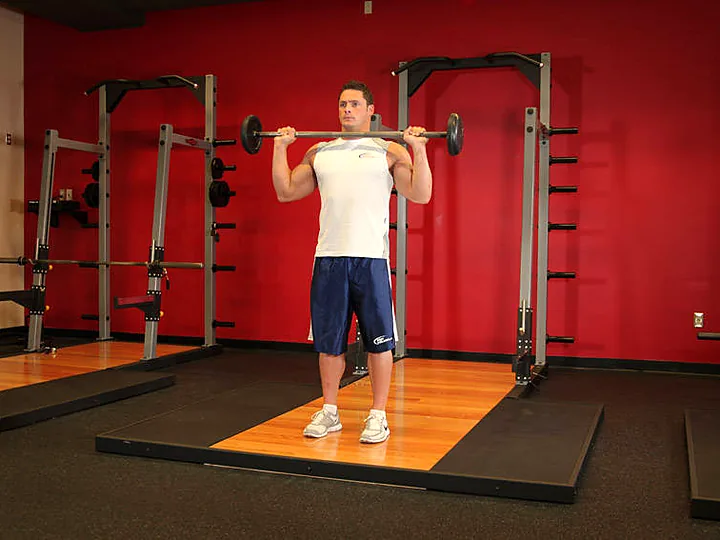 Standing Barbell Overhead Press: starting position